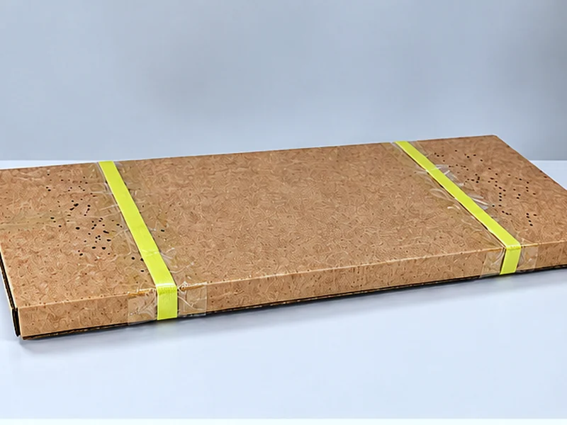 Stencil packed flat in a cardboard carton, strapped with PP banding
